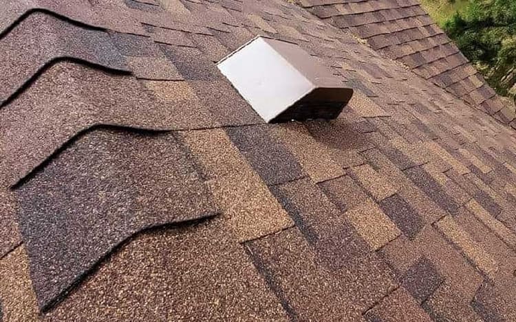 Roof of residential home with asphalt shingles
