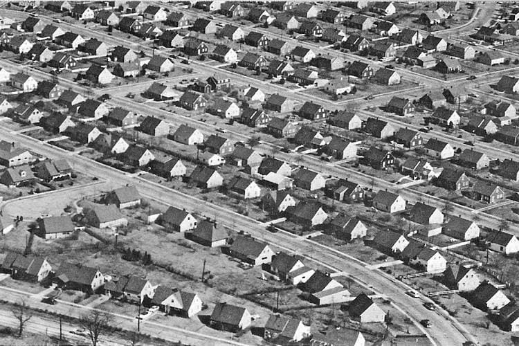 Aerial view of suburban houses in historic Levittown, New York in the 1950s