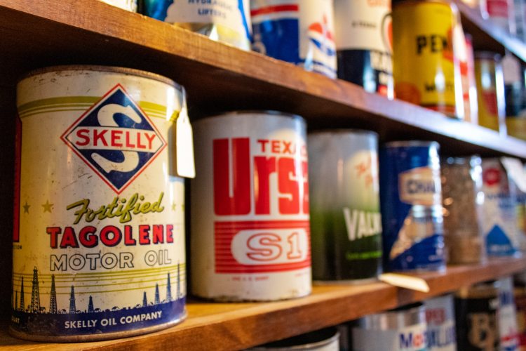 Shelf with motor oil cans in residential garage