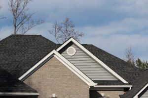 Residential roof with slate gray shingles